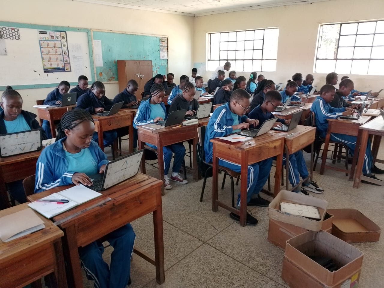 ICT class — students learning on laptops
