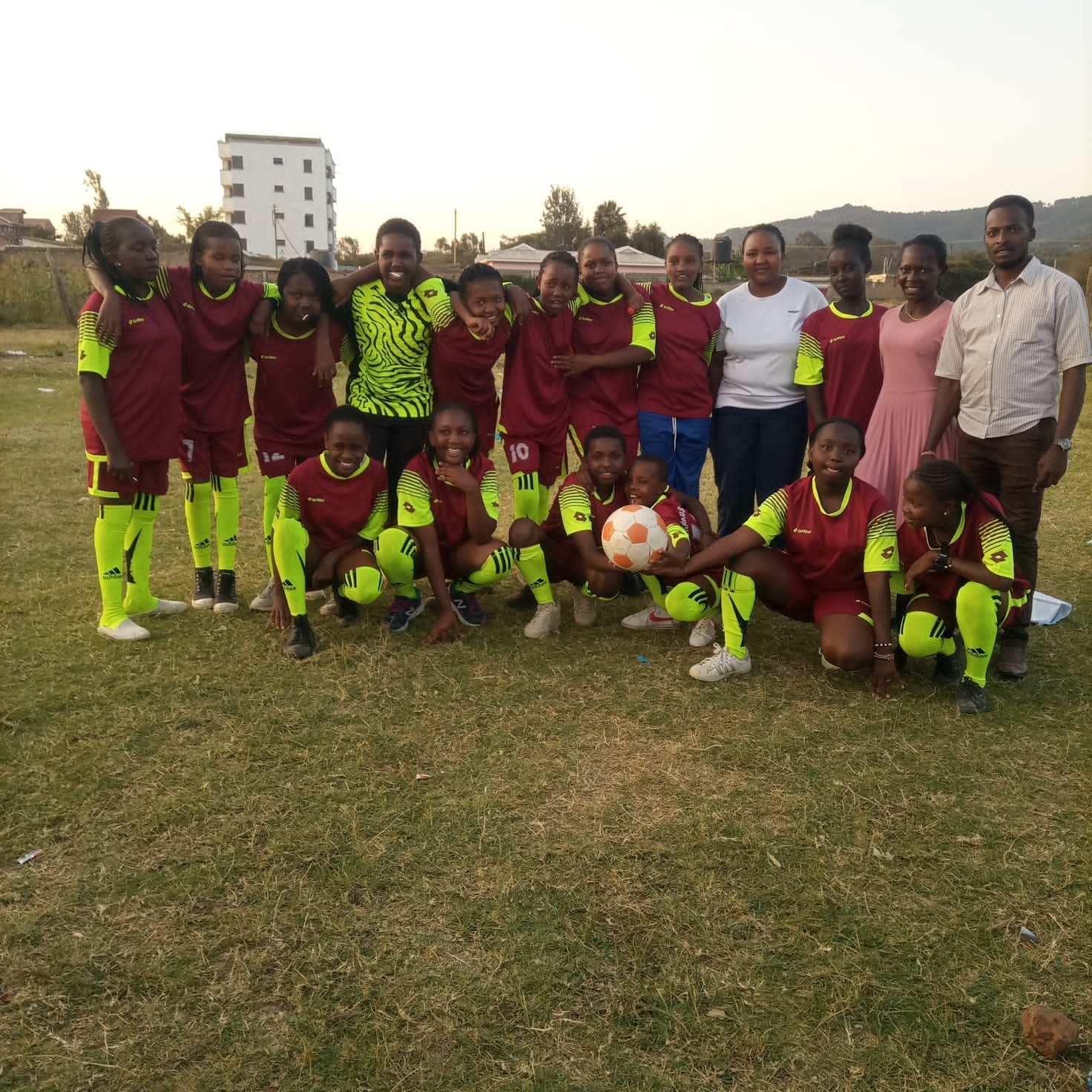 Girls soccer team with coaches